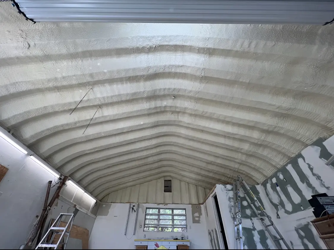 Spray polyurethane foam applied to the underside of a metal roof deck in Palestine